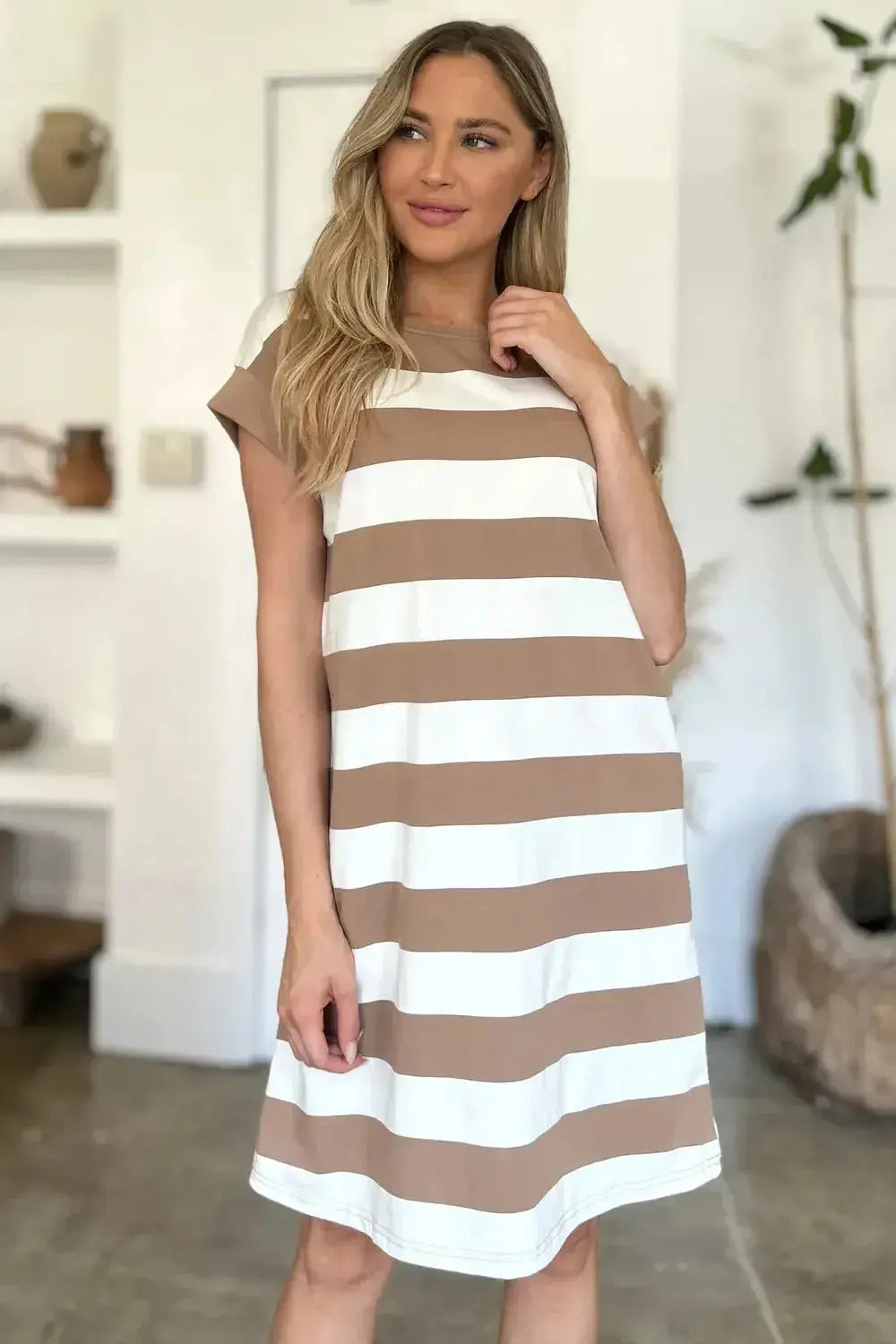 Women’s casual striped mini dress with round neck and cap sleeves by Plush Fashion Hub, featuring a stylish, relaxed fit.