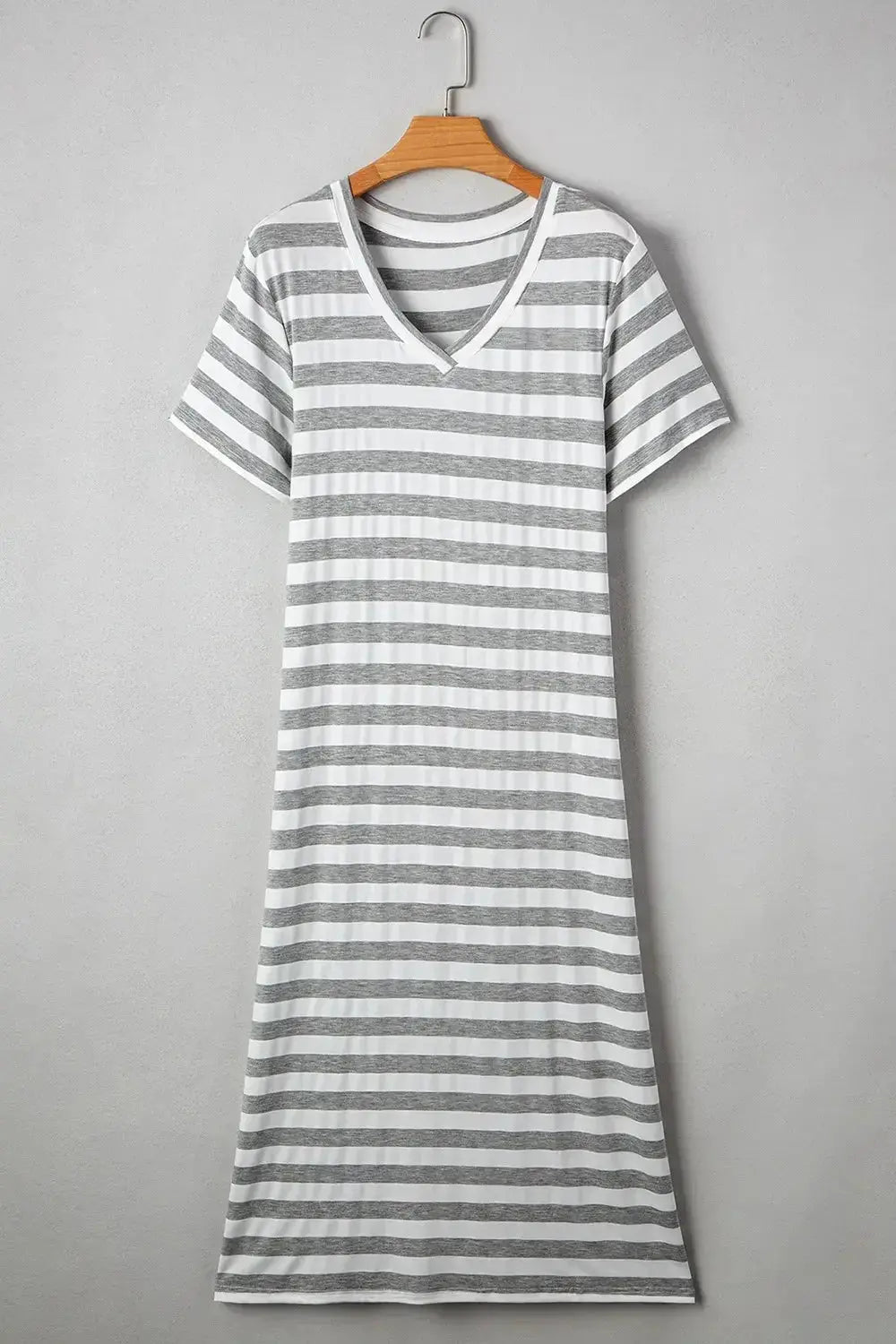 Women’s casual striped V-neck midi T-shirt dress by Trendsi, featuring comfortable fabric and a relaxed fit.