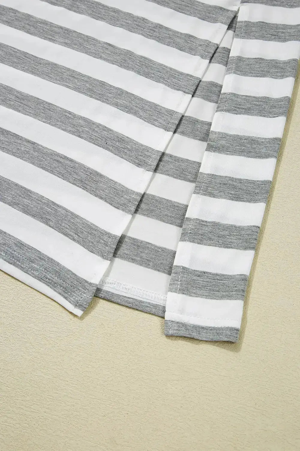 Women’s casual striped V-neck midi T-shirt dress by Trendsi, featuring a comfortable fit and stylish design.