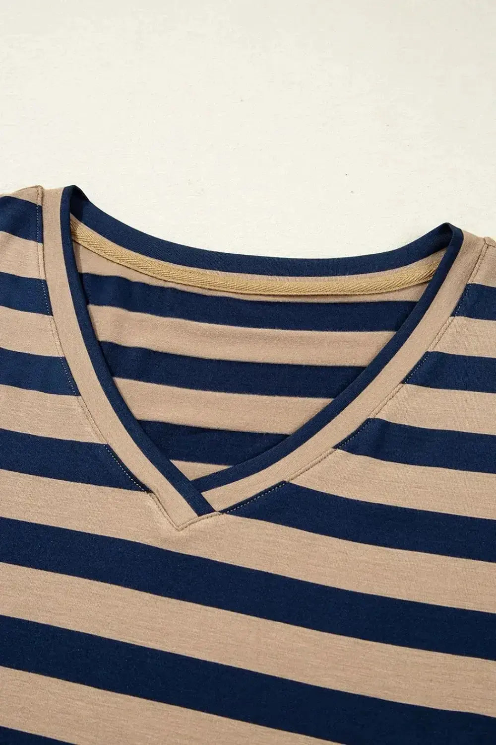 Women’s casual striped V-neck midi T-shirt dress by Trendsi, featuring a relaxed fit and comfortable fabric, perfect for everyday wear.