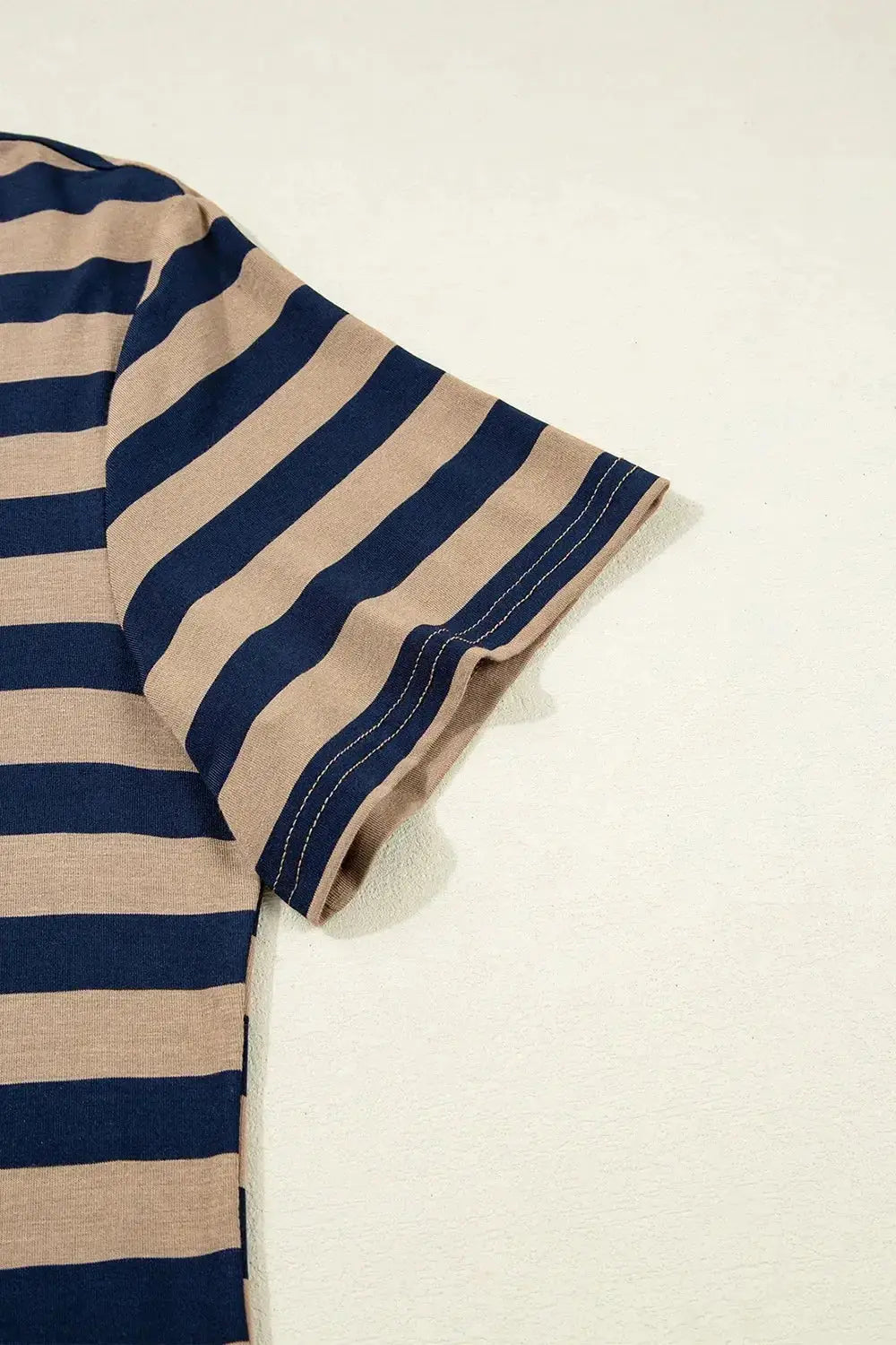 Women’s casual striped V-neck midi T-shirt dress by Trendsi, featuring a comfortable fit and stylish design, perfect for everyday wear.
