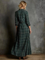Women's classic plaid button-down maxi dress with pockets by Trendsi, featuring a relaxed fit and stylish design.