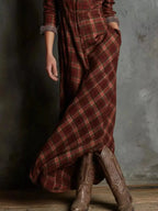 Women's classic plaid button-down maxi dress with pockets by Trendsi, featuring a relaxed fit and stylish design.