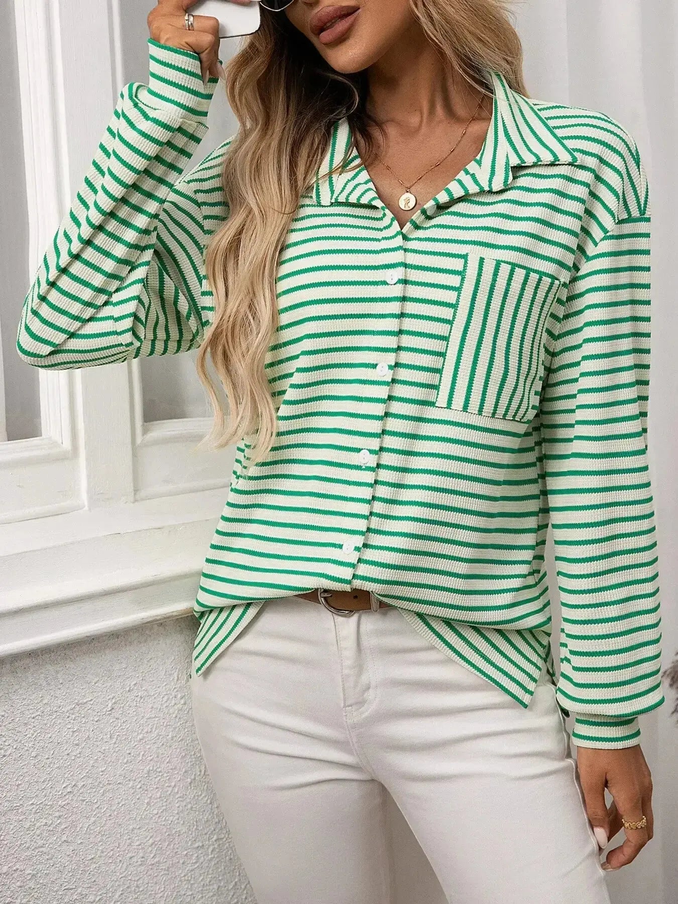 Women's classic striped long sleeve button-up shirt by Trendsi, perfect for versatile office wear, featuring a stylish, timeless design.