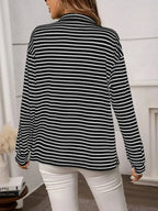 Women's classic striped long sleeve button-up shirt by Trendsi, versatile for office wear, featuring a stylish and timeless design.