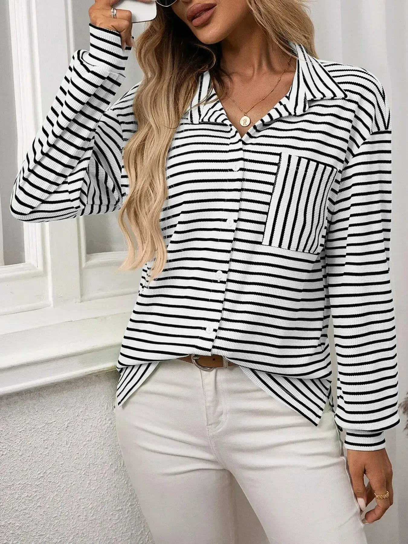 Women's classic striped long sleeve button-up shirt by Trendsi, perfect for versatile office wear, featuring a timeless design.