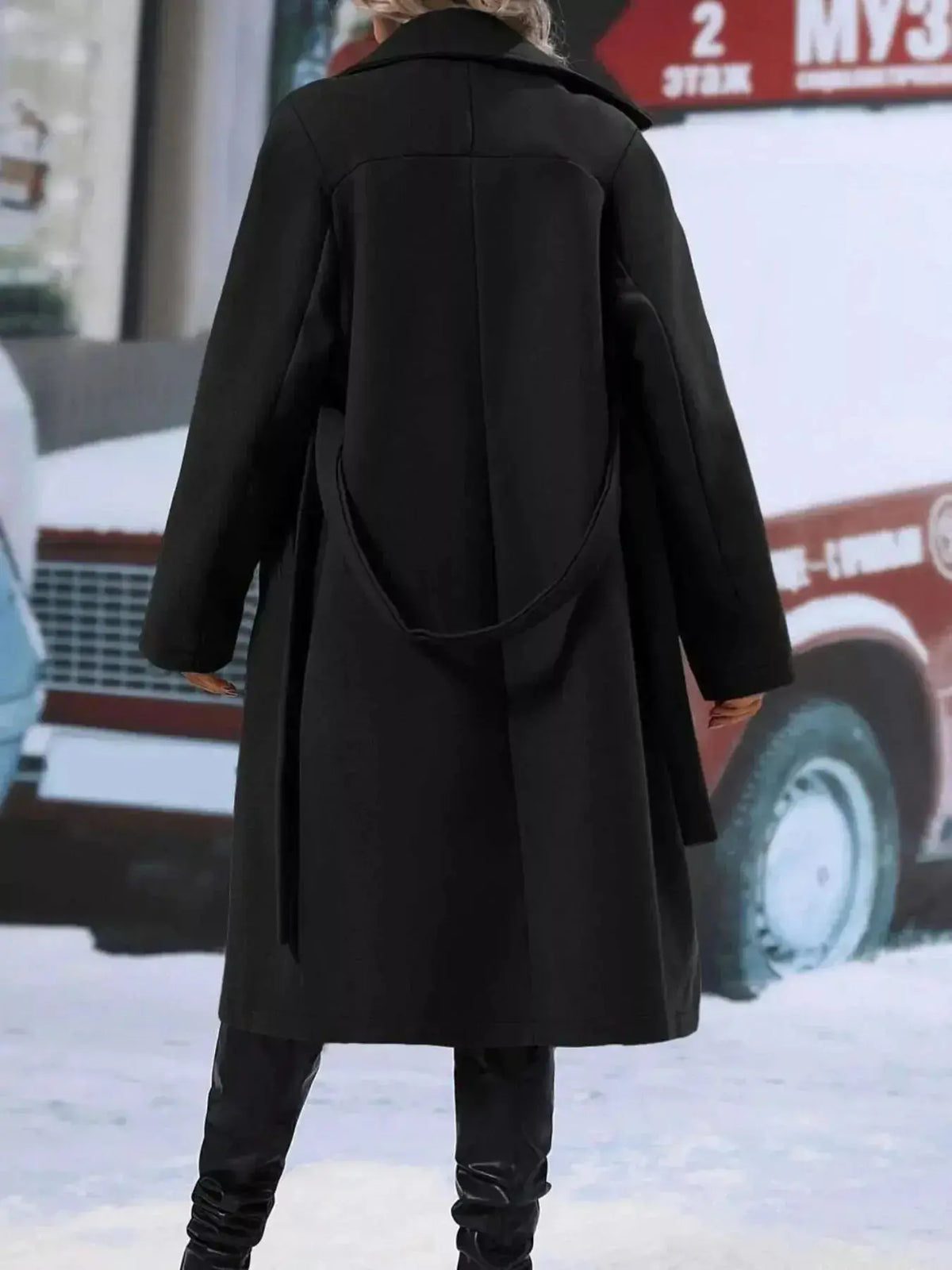 Women’s double-breasted trench coat with tie waist belt, stylish outerwear from Plush Fashion Hub, shown on a model.