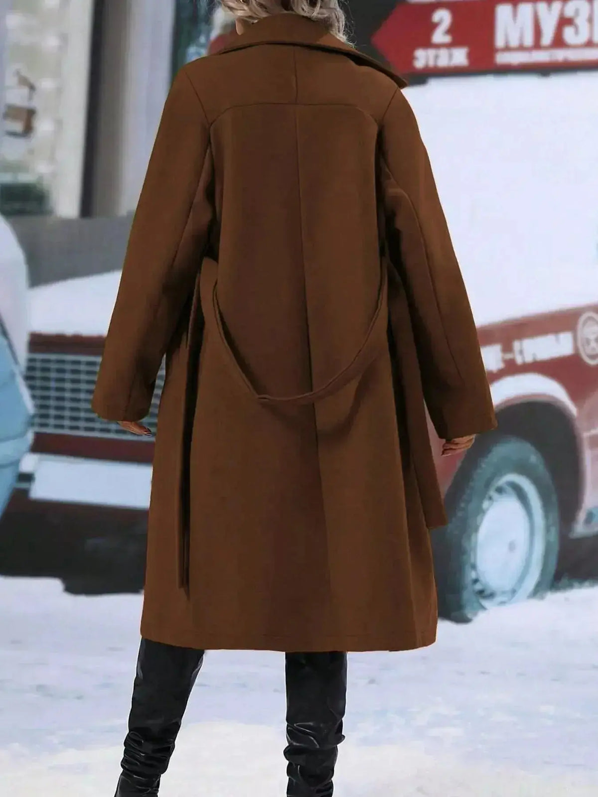 Women’s double-breasted trench coat with tie waist belt from Plush Fashion Hub, featuring classic design and stylish details.