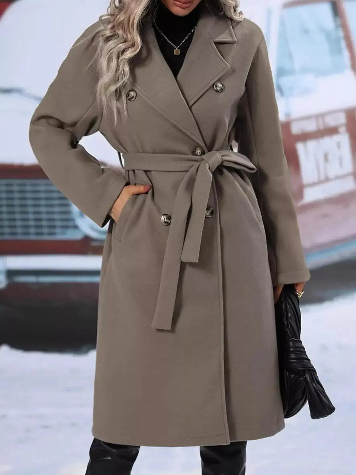 Women’s double-breasted trench coat by Plush Fashion Hub featuring a tie waist belt and classic design, shown on a model.