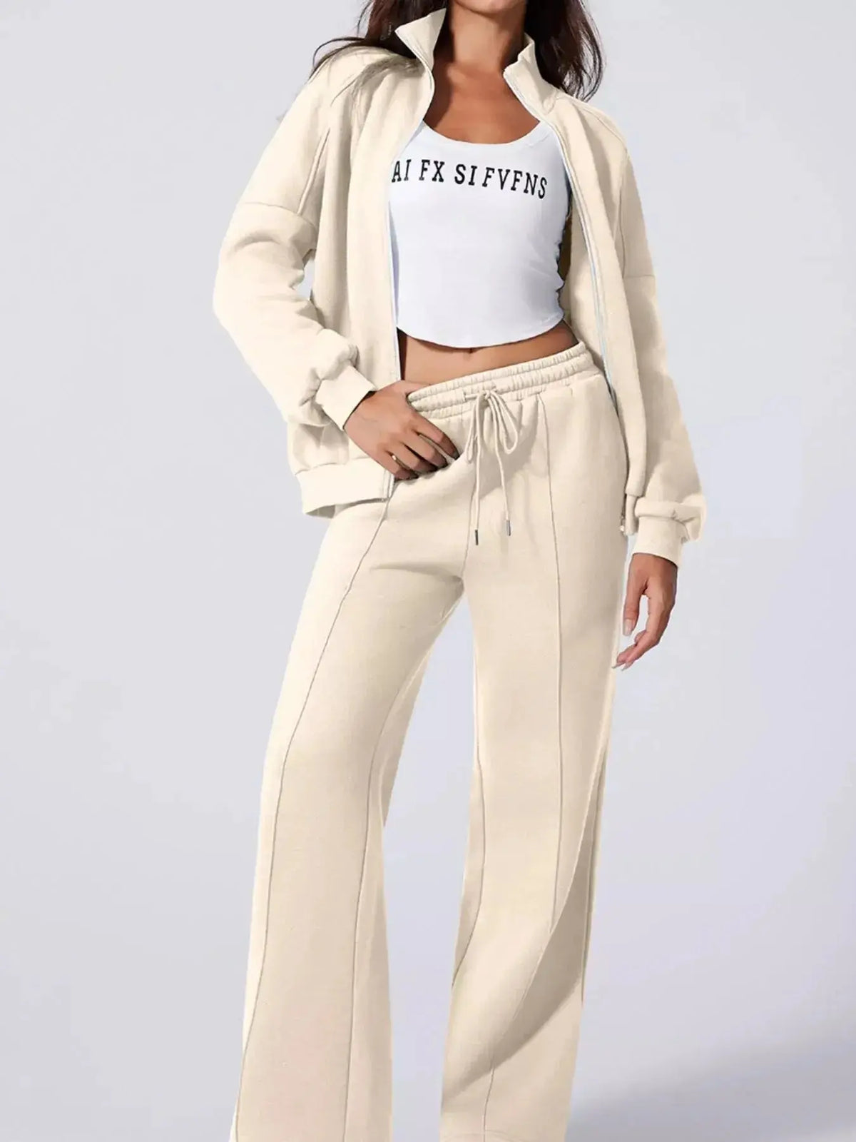Women wearing Plush Fashion Hub's drop shoulder zip-up jacket and jogger lounge set, casual two-piece sweat suit.