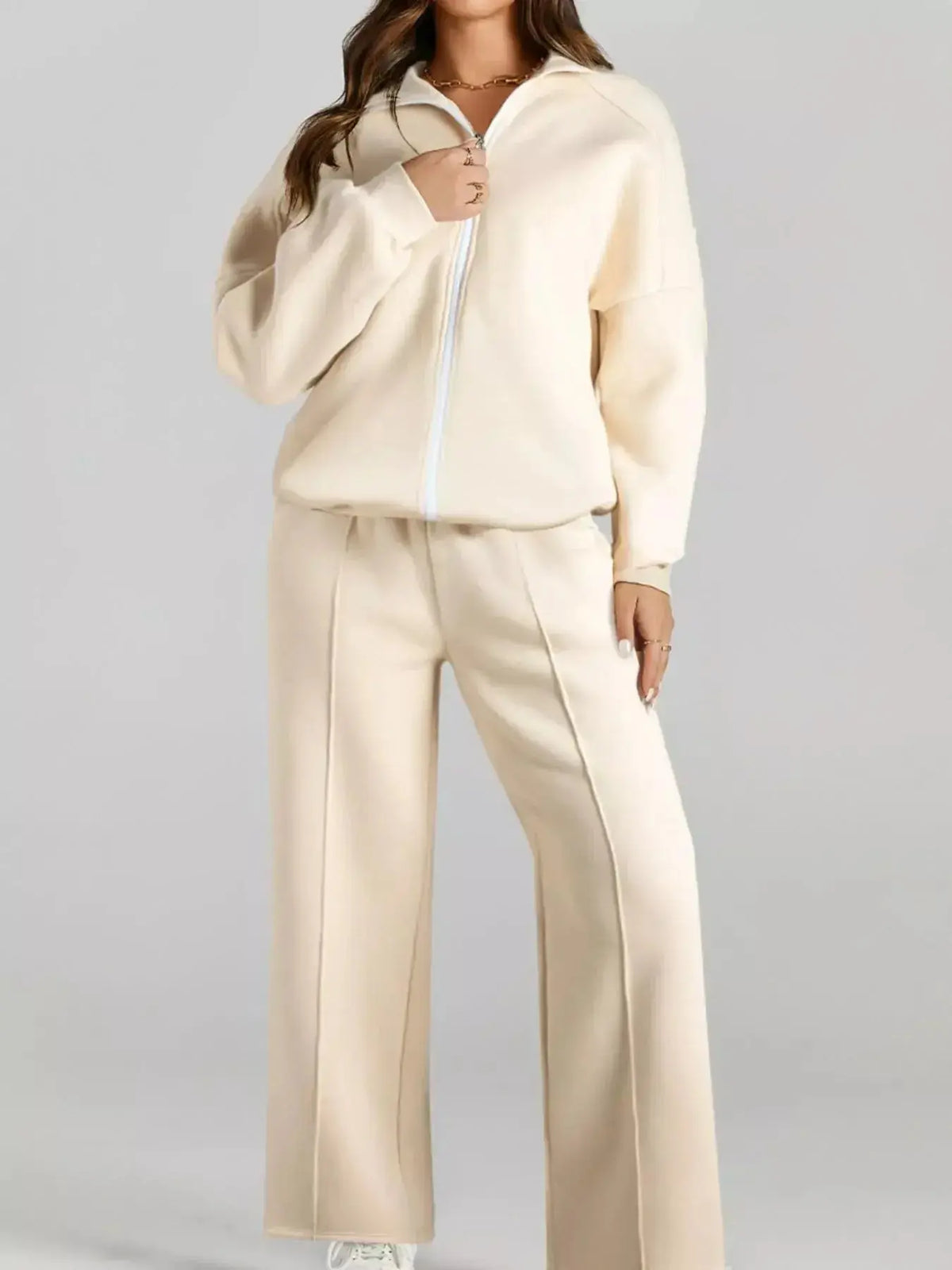 Women wearing Plush Fashion Hub women's drop shoulder zip-up jacket and jogger lounge set, cozy sweat suit ensemble.