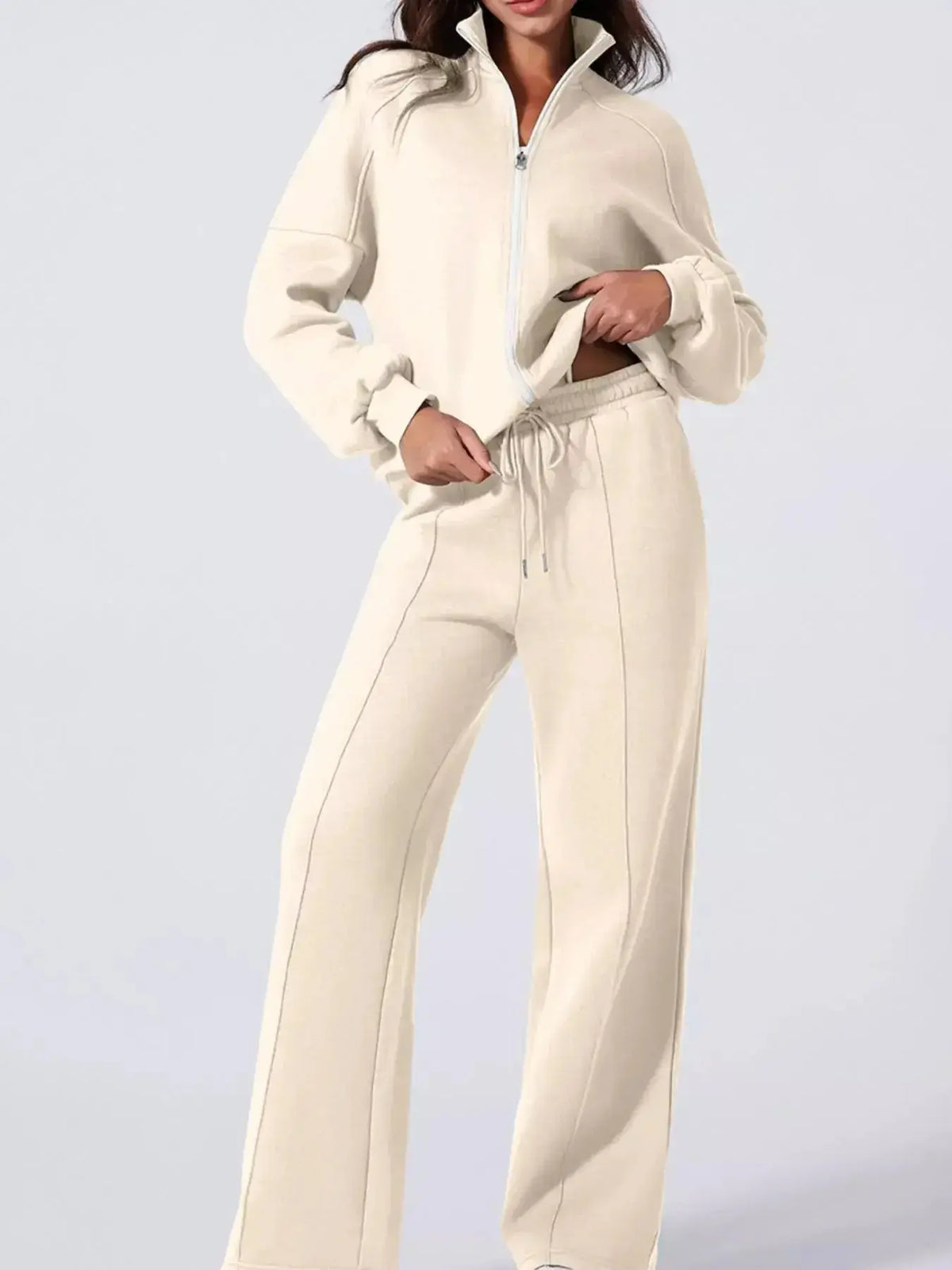 Women's plush fashion hub drop shoulder zip-up jacket and matching jogger lounge set, comfortable and stylish sweat suit ensemble.