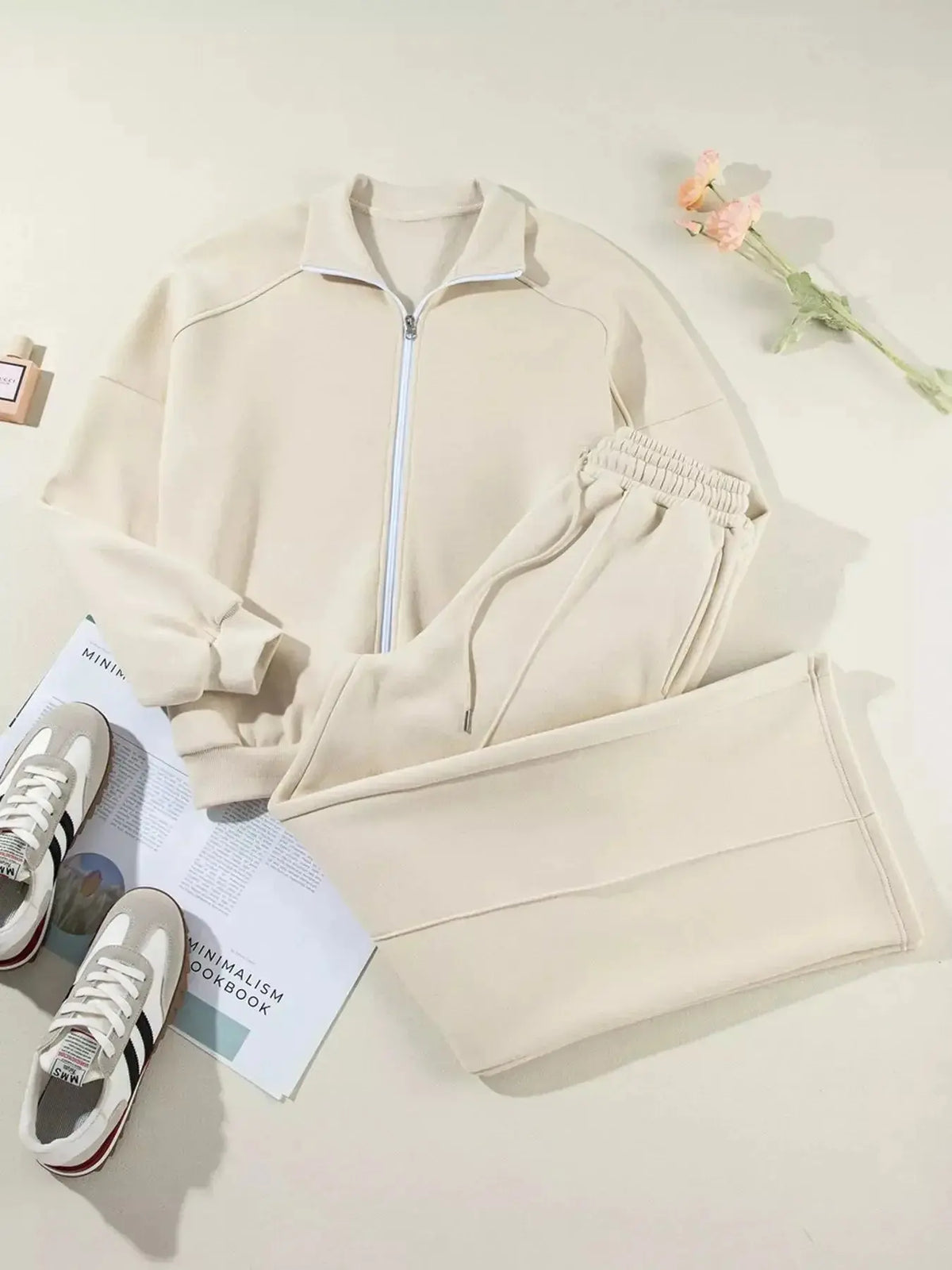 Women wearing Plush Fashion Hub drop shoulder zip-up jacket and matching jogger lounge set, casual and comfortable sweat suit.