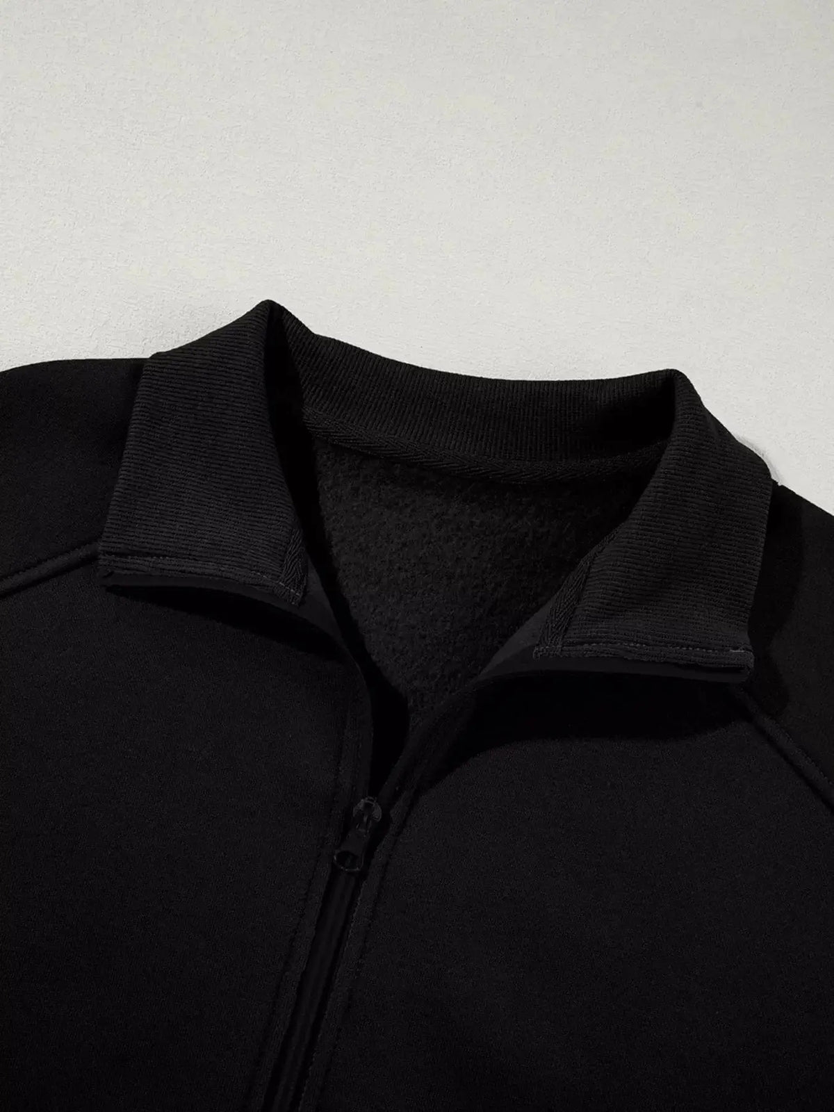 Women wearing Plush Fashion Hub drop shoulder zip-up jacket and matching jogger lounge set, casual and comfortable indoor outfit.