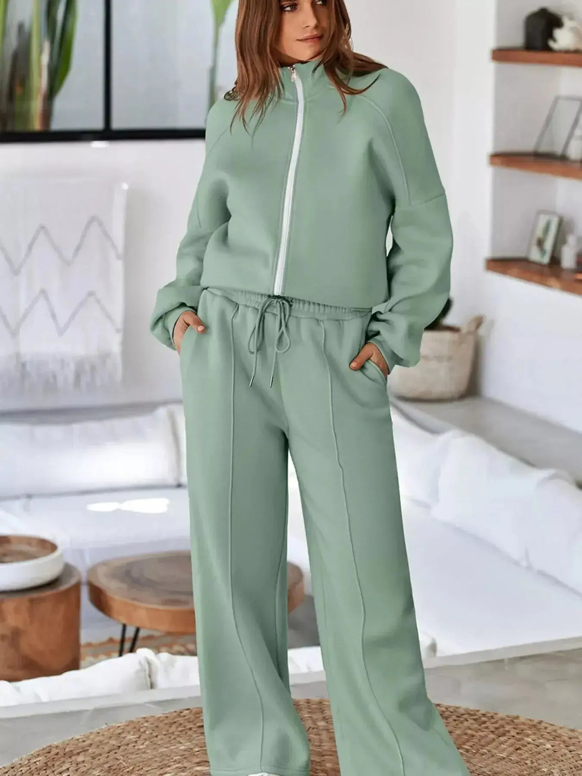 Women wearing Plush Fashion Hub's drop shoulder zip-up jacket and jogger two-piece lounge set, comfortable and stylish sweat suit.