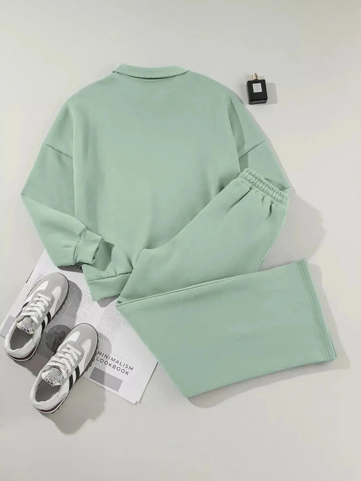 Women wearing Plush Fashion Hub women's drop shoulder zip-up jacket and jogger lounge set, comfortable matching sweat suit.