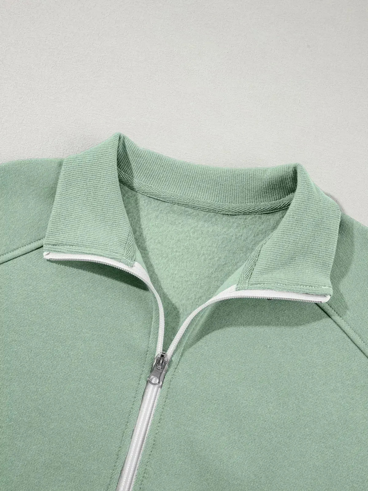 Women wearing Plush Fashion Hub drop shoulder zip-up jacket and jogger lounge set, casual two-piece sweat suit, relaxed fit.