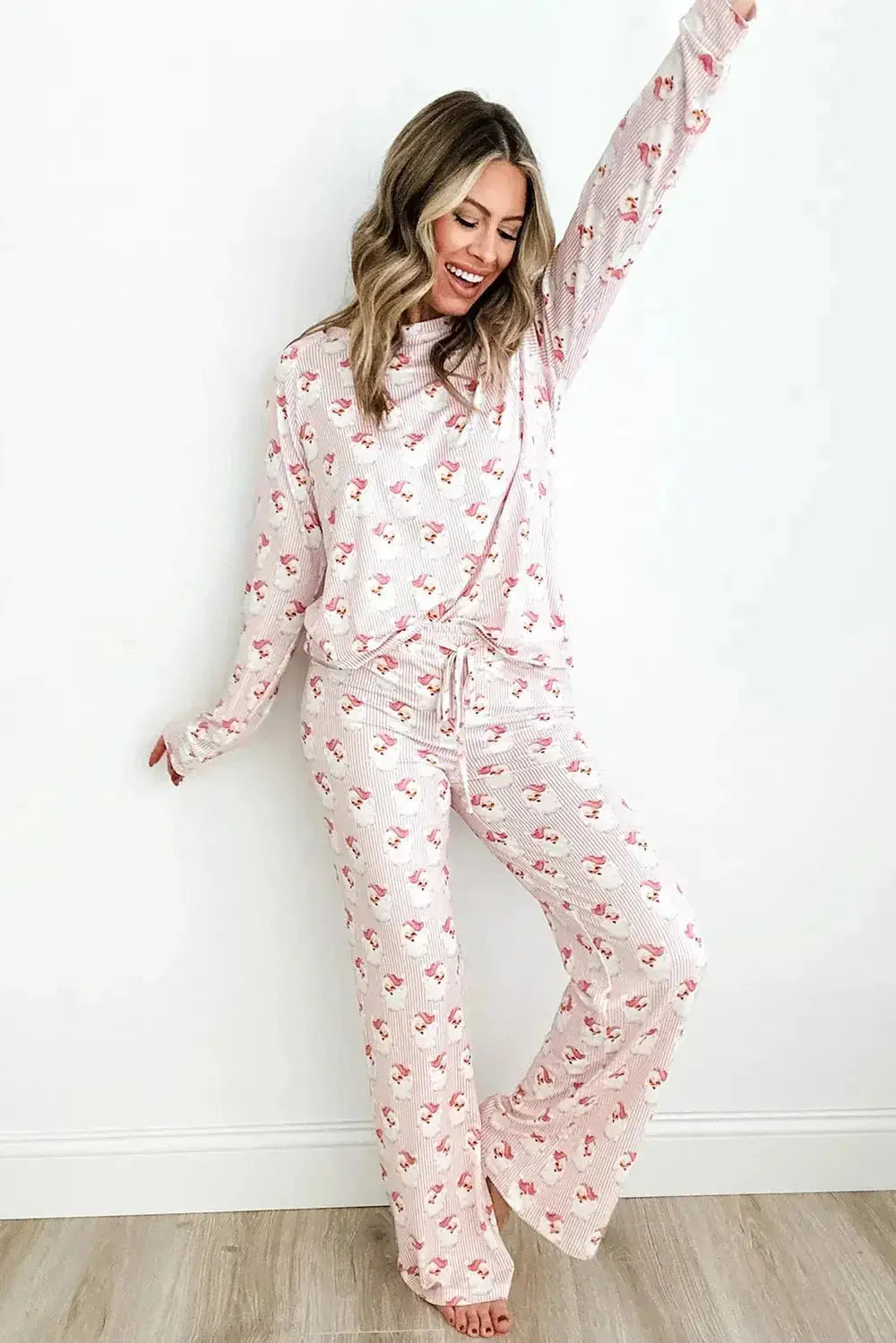 Women’s festive Santa print long sleeve pajama lounge set by Plush Fashion Hub, featuring cozy holiday-themed pajamas.