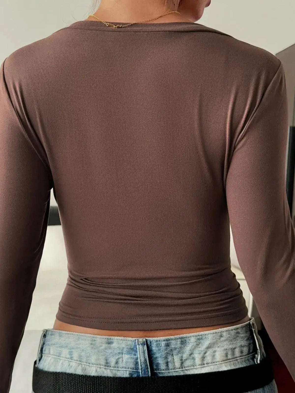 Women wearing Plush Fashion Hub fitted V-neck long sleeve essential T-shirt, showcasing a comfortable, stylish women's T-shirt.