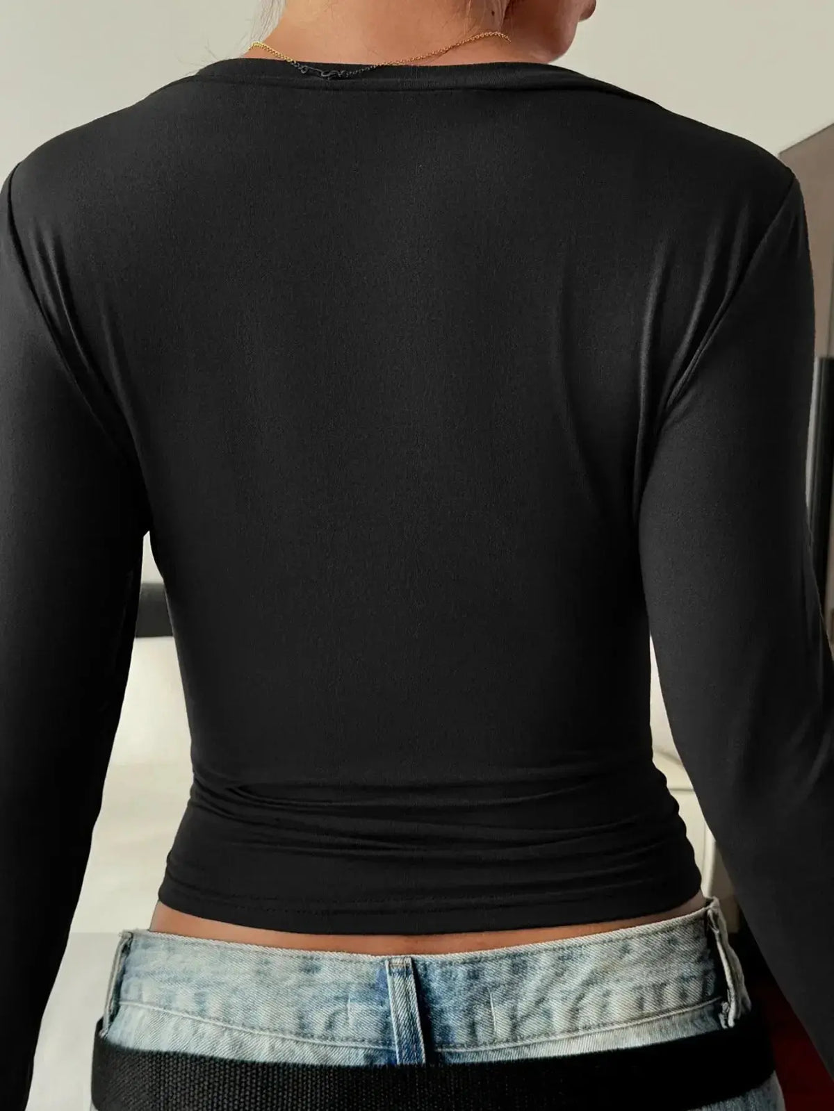 Women’s fitted V-neck long sleeve essential T-shirt by Plush Fashion Hub, shown in a versatile, casual fit with long sleeves.