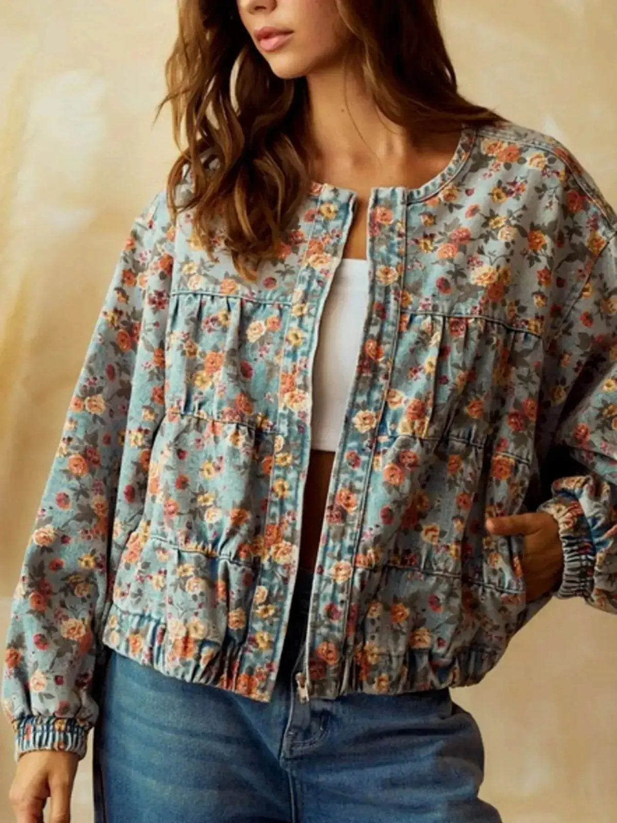 Women's floral print cropped denim utility jacket by Plush Fashion Hub, featuring zip-up front and cotton blend fabric.