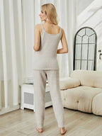 Women's fuzzy V-neck cami and pants two-piece lounge sleepwear set, cozy pajamas by Trendsi with soft, plush fabric.
