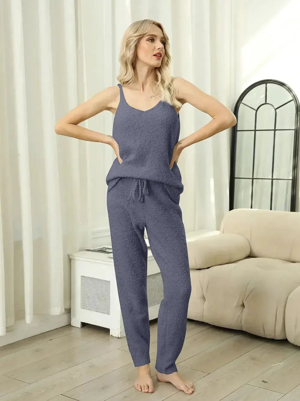 Women's fuzzy V-neck cami and pants two-piece lounge sleepwear set by Trendsi, featuring soft, cozy fabric and relaxed fit.