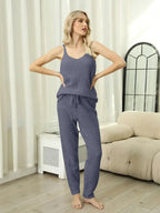 Women's fuzzy V-neck cami and pants two-piece lounge sleepwear set by Trendsi, featuring soft, cozy fabric and relaxed fit.