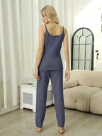 Women’s fuzzy V-neck cami and pants two-piece lounge sleepwear set, cozy pajamas by Trendsi, featuring soft fabric and relaxed fit.