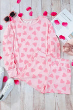 Women's heart print long sleeve pajama set featuring a cozy two-piece plush lounge outfit by Trendsi.