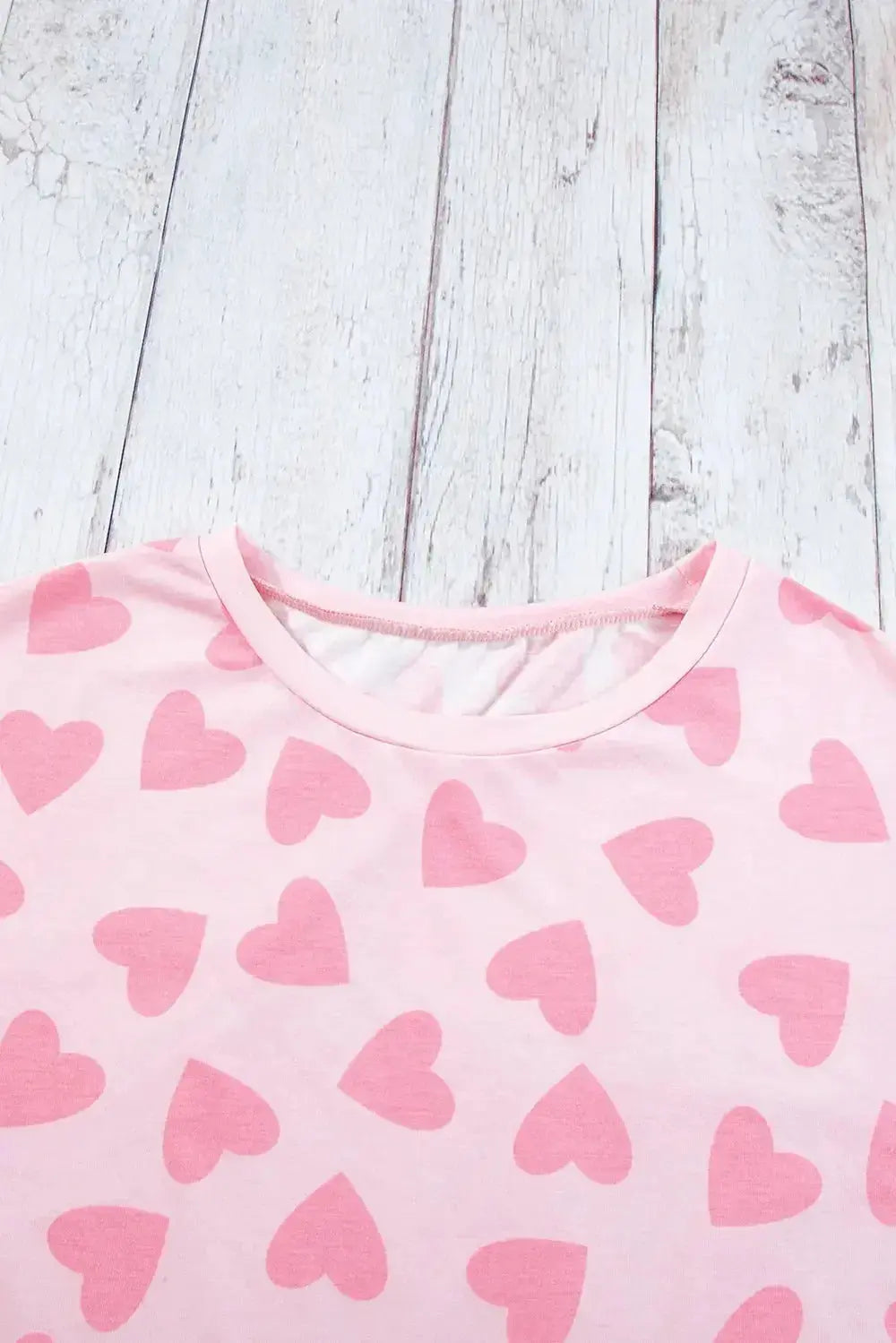 Women's heart print long sleeve lounge set by Trendsi, cozy two-piece pajama with plush fabric and relaxed fit.