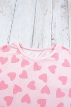 Women's heart print long sleeve lounge set by Trendsi, cozy two-piece pajama with plush fabric and relaxed fit.