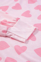 Women's heart print long sleeve pajama set featuring a cozy two-piece plush lounge sleepwear by Trendsi.