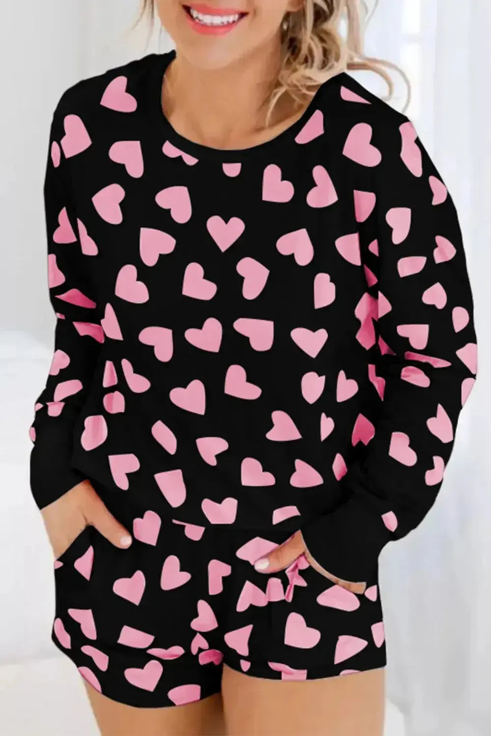 Women's heart print long sleeve pajama set with cozy long pants, plush fabric, comfortable lounge pajamas from Trendsi.