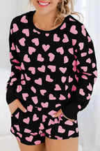 Women's heart print long sleeve pajama set with cozy long pants, plush fabric, comfortable lounge pajamas from Trendsi.