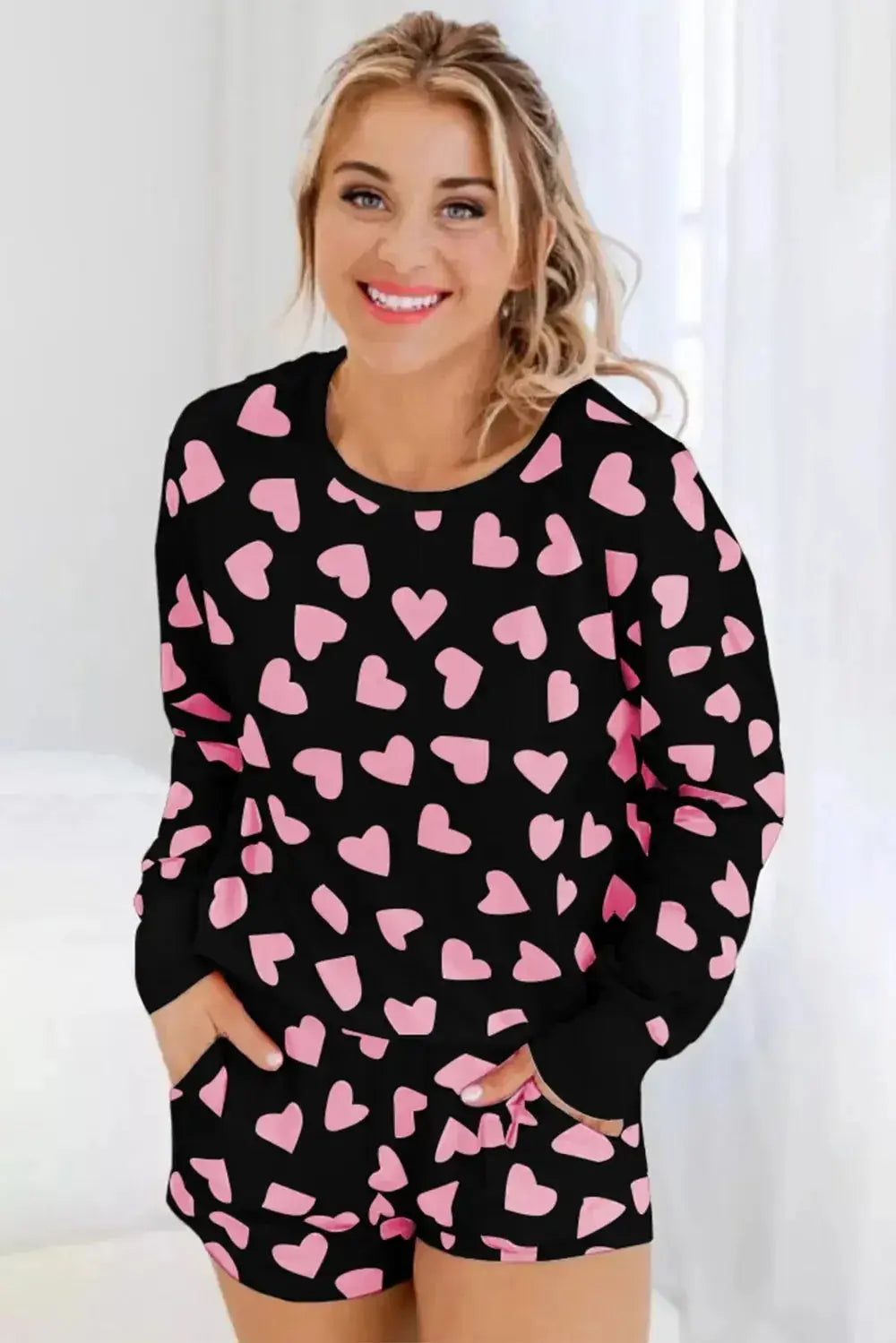 Women’s heart print long sleeve pajama set featuring a cozy two-piece plush lounge set by Trendsi.