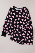 Women’s heart print long sleeve pajama set by Trendsi, featuring a cozy two-piece plush lounge pajamas with a charming heart pattern.