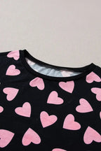 Women's heart print long sleeve lounge set, cozy pajama two-piece with plush fabric, from Trendsi.
