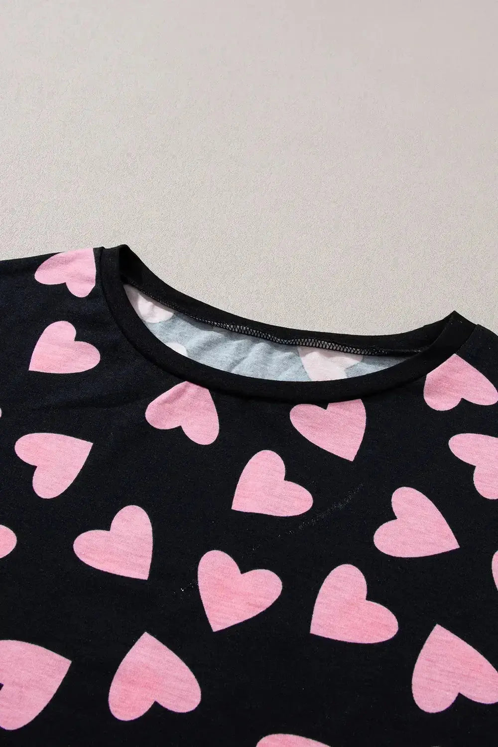 Women's heart print long sleeve lounge set, cozy pajama two-piece with plush fabric, from Trendsi.