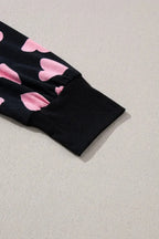 Women's heart print long sleeve pajama set with cozy plush fabric, two-piece lounge set by Trendsi.