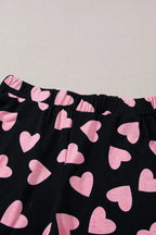 Women’s heart print long sleeve lounge set by Trendsi, cozy two-piece pajama with plush fabric and comfortable fit.