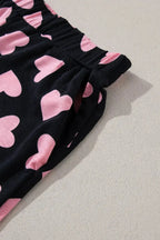 Women's heart print long sleeve pajama set by Trendsi featuring a cozy two-piece plush lounge and sleepwear for comfort.