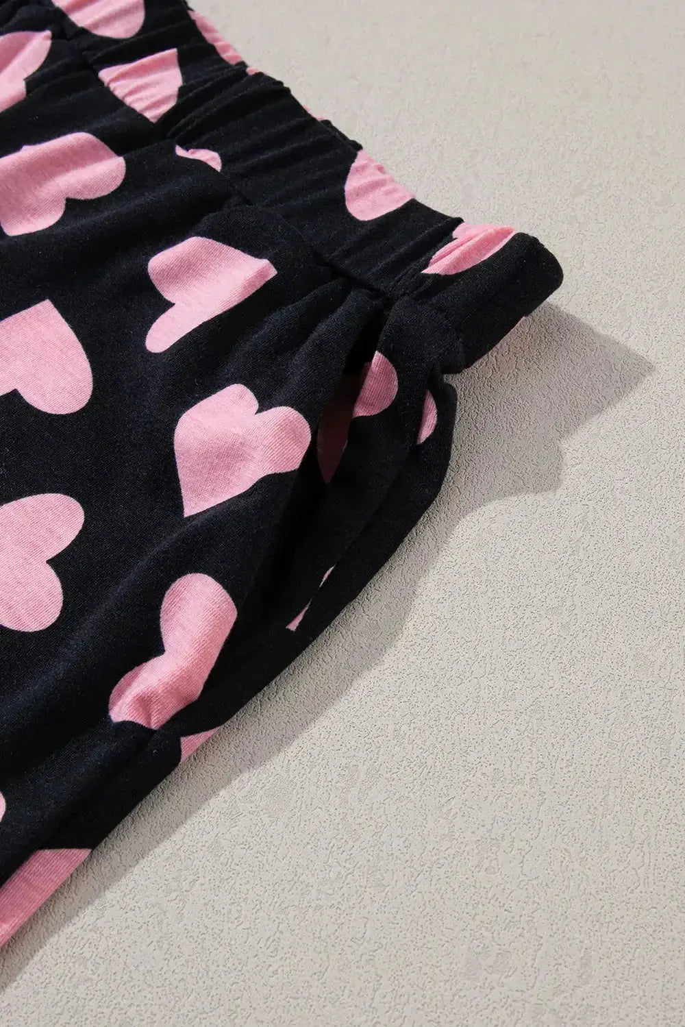 Women's heart print long sleeve pajama set by Trendsi featuring a cozy two-piece plush lounge and sleepwear for comfort.