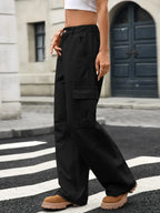 Women’s high-rise wide-leg cargo jeans by Trendsi featuring trendy utility denim style and spacious pocket details.