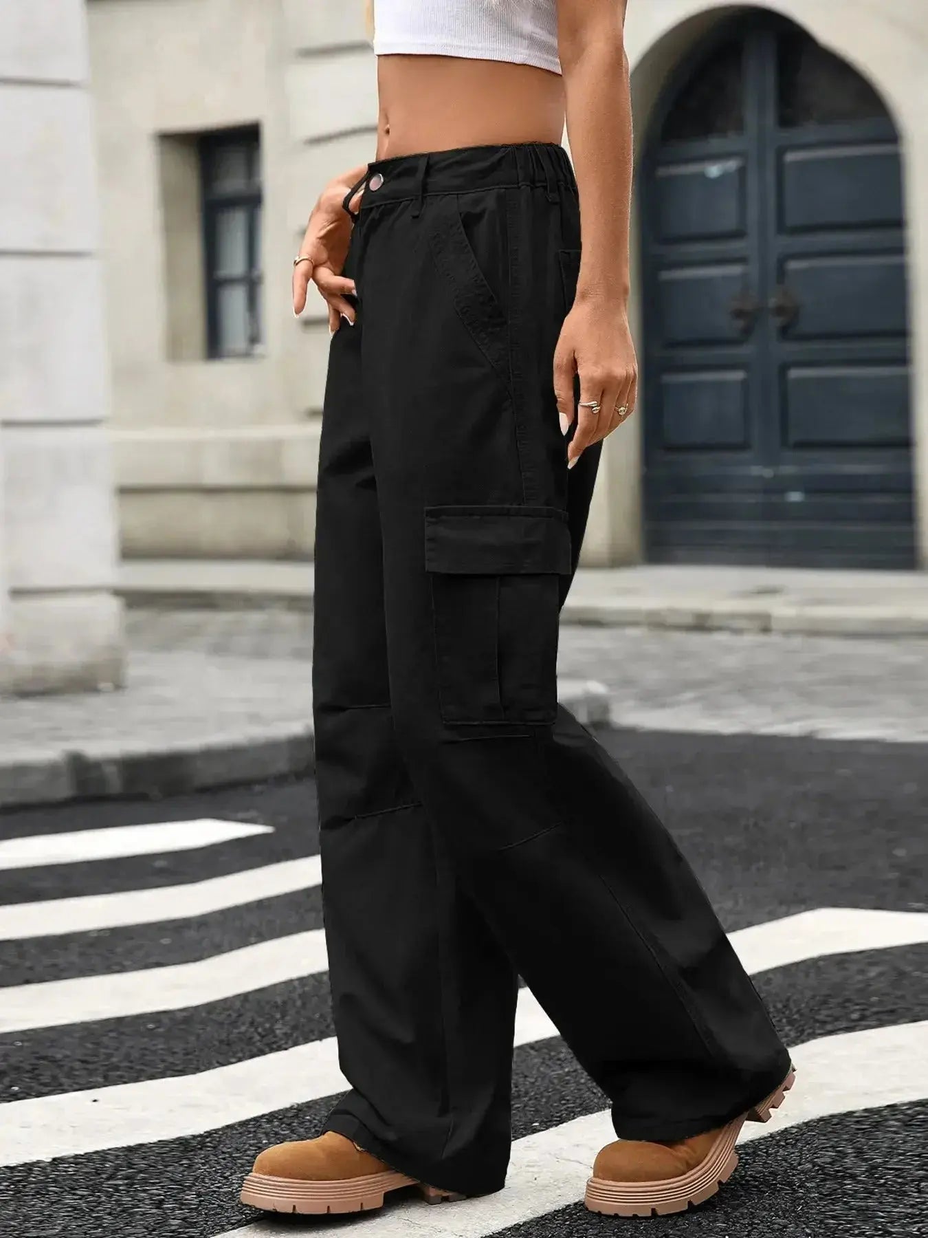 Women’s high-rise wide-leg cargo jeans by Trendsi featuring trendy utility denim style and spacious pocket details.