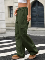Women’s high-rise wide-leg cargo jeans by Trendsi featuring utility denim style with multiple side pockets and relaxed fit.