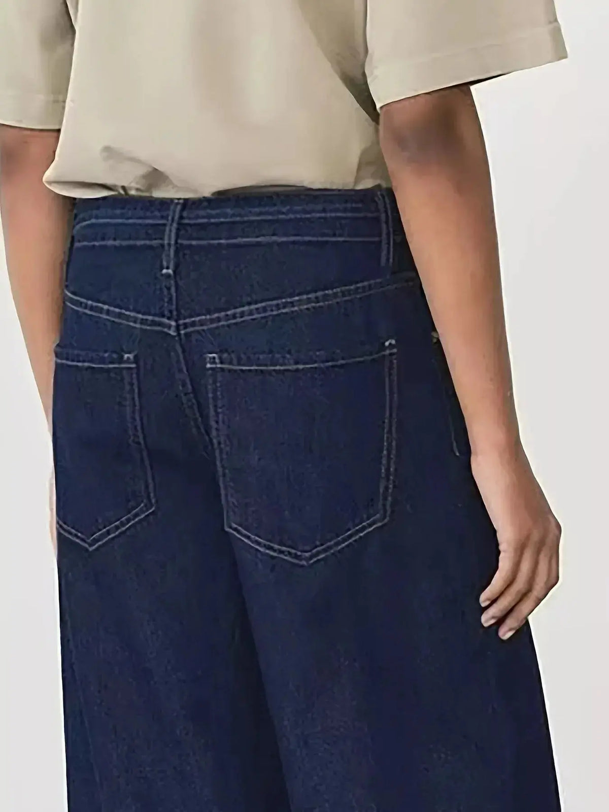 Women’s high-waisted flare jeans by Plush Fashion Hub, with a tied waist, loose fit, and relaxed denim style.
