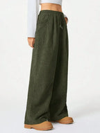 Women’s high-waisted wide-leg lounge pants with drawstring waist, casual and comfortable, ideal for relaxed everyday wear.