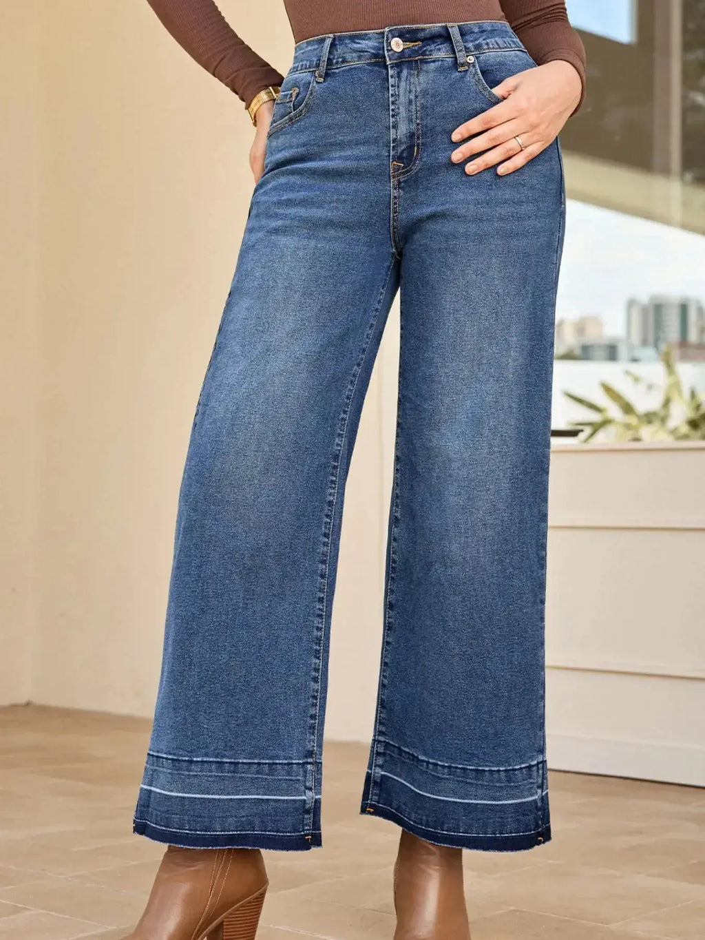 Women’s high-waisted wide-leg washed denim jeans with a relaxed fit, showcasing classic style and trendy fashion from Trendsi.