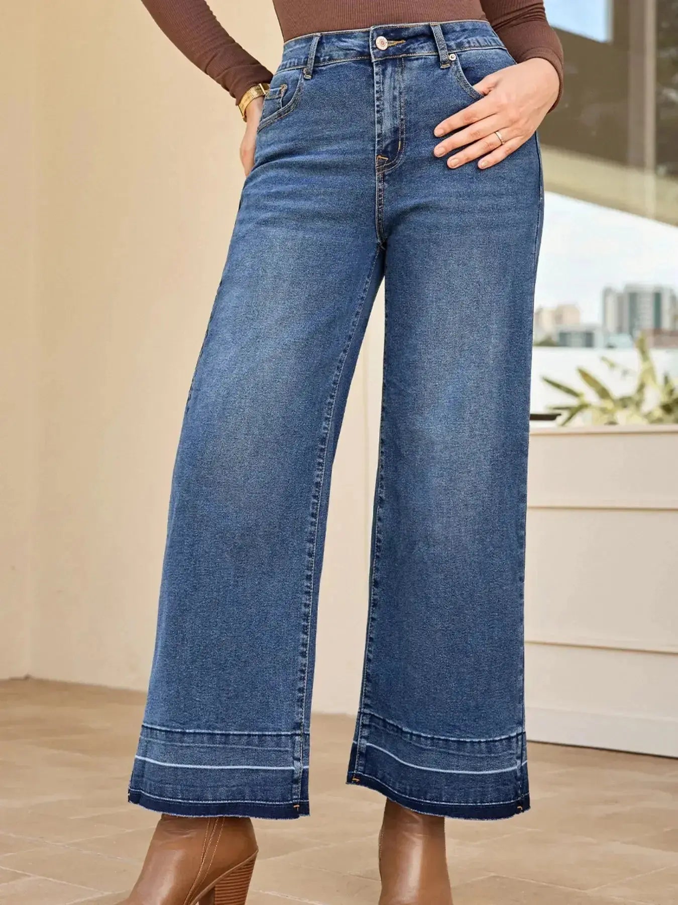 Women’s high-waisted wide-leg washed denim jeans with a relaxed fit, showcasing classic style and trendy fashion from Trendsi.